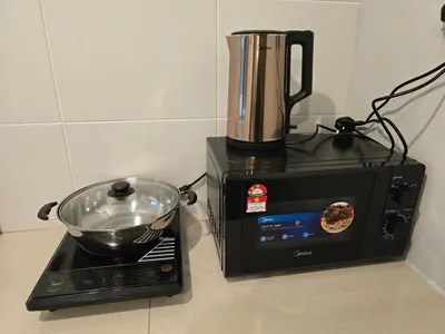 a blender sitting on a counter next to a microwave at Manhattan Condo - Ipoh Merveille Luxe Stay in Ipoh
