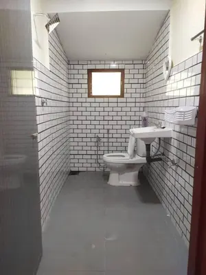 a bathroom with a toilet and a sink at Teratak Desa Cemerlang 3 in Kuala Kangsar