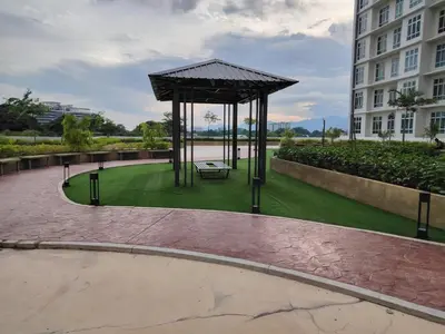 a gazebo with a bench in a park at CK Homestay in Ipoh