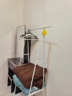 a bunk bed with a mirror and a lamp at Annur homestay in Tanah Rata
