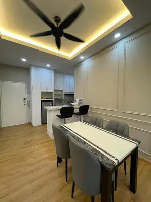 a dining room with a table and a ceiling fan at Ipoh Anderson Residence in Ipoh
