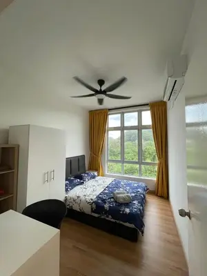 a bedroom with a bed and a ceiling fan at Ipoh Anderson Residence in Ipoh