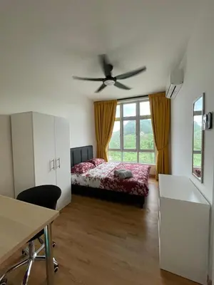 a bedroom with a bed and a ceiling fan at Ipoh Anderson Residence in Ipoh
