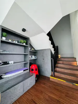a living room with stairs and a red car in it at AYAAN Foosball Penthouse at Golden Hill with Private Parking and Netflix in Brinchang