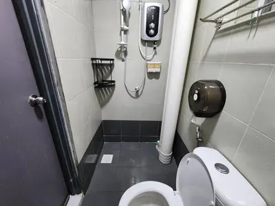 a small bathroom with a toilet and a shower at 6-17 Galaxy Styles Emerald Aveneu in Brinchang