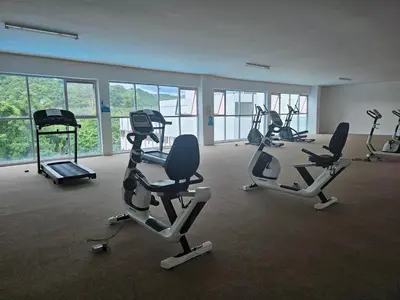 a gym with several exercise bikes in a room at Ipoh Anderson Condo - 2BR in Ipoh