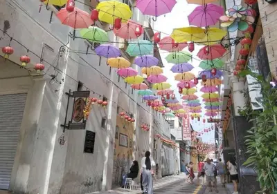 a bunch of umbrellas hanging over a street at Ipoh Anderson Condo - 2BR in Ipoh