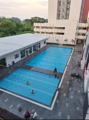 an overhead view of a large swimming pool in a building at Ipoh Condo Anderson residence in Ipoh