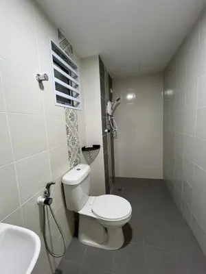 a bathroom with a white toilet and a sink at Ipoh Condo Anderson residence in Ipoh