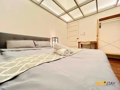 a bedroom with a large bed with a window at SS2 Landed in Petaling Jaya for 8 Pax in Gua Sai