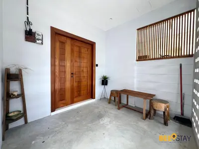 a room with a wooden door and a table at SS2 Landed in Petaling Jaya for 8 Pax in Gua Sai