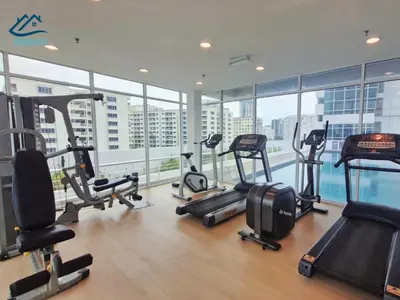 a gym with treadmills and exercise equipment in a building at Duplex Comfort Stay in George Town in George Town