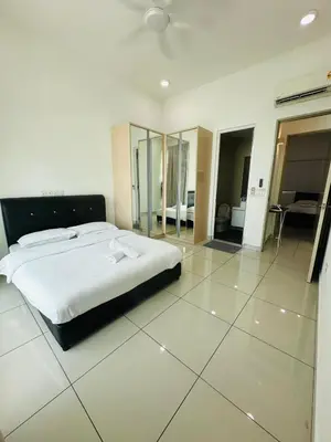 a bedroom with a large white bed and a mirror at Seaview Condo A31 #Queensbay#SPICE in Bayan Lepas