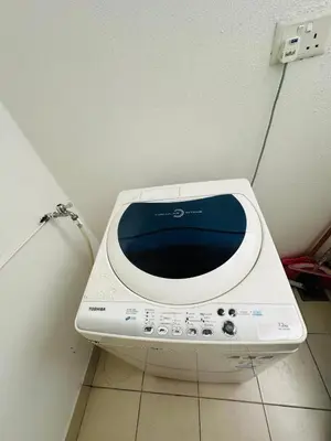 a microwave sitting on the floor of a room at Seaview Condo A31 #Queensbay#SPICE in Bayan Lepas