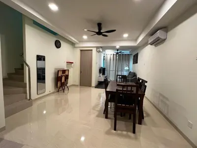 a dining room with a table and a ceiling fan at AP Homestay in Sekincan