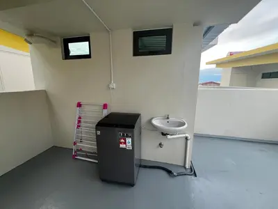 a small bathroom with a sink and a counter at AP Homestay in Sekincan