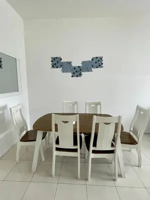 a dining room with a table and chairs at Ayaan Fifa Home Juniors with Netflix and Ps4 Games in Tanah Rata