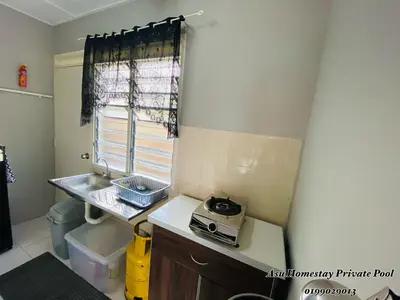 a small kitchen with a sink and a window at Asu Homestay w Private Pool - Batu Gajah,Perak in Batu Gajah