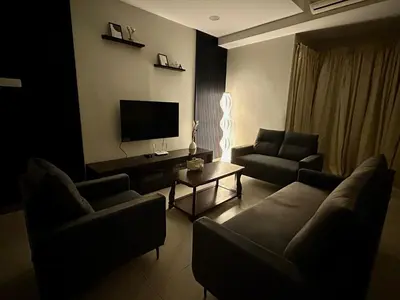 a living room with a couch and a tv at \u7a3b\u5cb8 DaoAn Homestay-with balcony in Sekincan