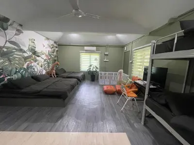 a living room with a couch and a tv at Kerlingfornia Pond View Homestay and Farmstead in Kerling