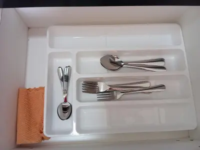 a white tray with silver utensils in it at Radif Homestay Seri Iskandar#1 in Kampong Bota Road