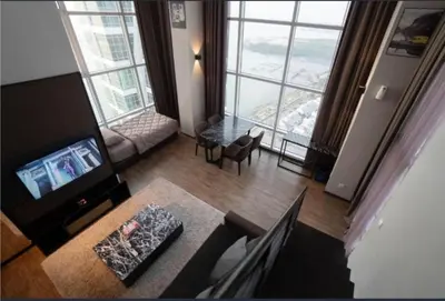 an aerial view of a living room with a large window at Maritime suite Karpal sign sea view in George Town