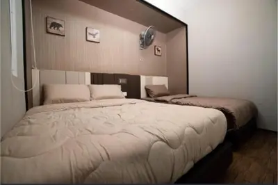 a bedroom with a large bed with a mirror at Maritime suite Karpal sign sea view in George Town