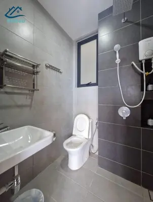 a bathroom with a toilet and a sink and a shower at Urban Suites Apartment In Jelutong George Town in George Town