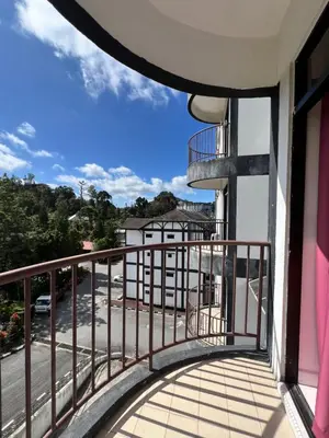 a balcony with a view of a parking lot at Highland Breze Homestay in Tanah Rata