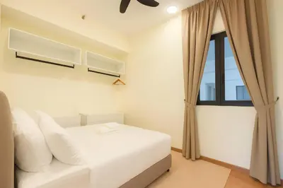 a bedroom with a white bed and a window at \u3010Lux\u3011HighFloor wi SunSet | Infinity Pool | KTV 207 in George Town