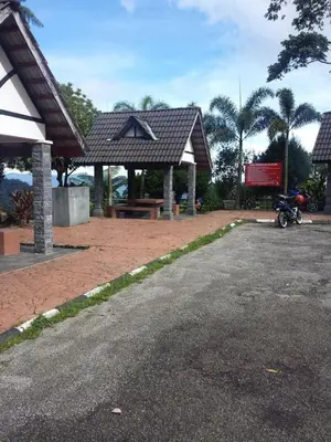 a motorcycle parked in front of a pavilion at A356 Silverpark Resort lifted unit 5th floor in Bukit Fraser