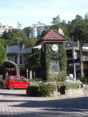 a building with a clock on top of it at A356 Silverpark Resort lifted unit 5th floor in Bukit Fraser