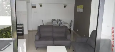 a living room with a chair and a table at A356 Silverpark Resort lifted unit 5th floor in Bukit Fraser