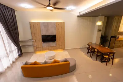 a living room with a couch and a table at #15mins walk to Kea Farm#4bedrooms4bathrooms#10pax in Brinchang
