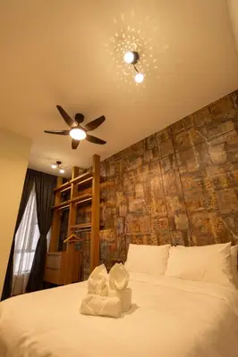 a bedroom with a white bed with a ceiling fan at #15mins walk to Kea Farm#4bedrooms4bathrooms#10pax in Brinchang