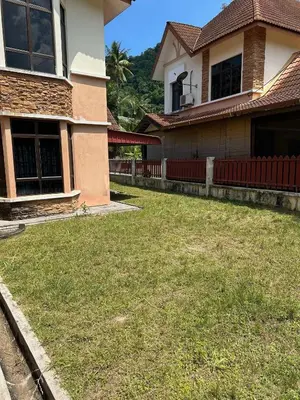 a yard in front of a house at GS Homestay Whole Villa in Gertak Sanggul
