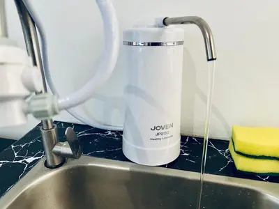 a jug of water sitting next to a sink at Muji 2B2R 12pax Sunrise Seaview Georgetown Suite in George Town