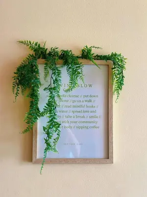 a picture of a sign with ivy on a wall at The Cozy Wooden Stay #PalasHorizon#5-7 minutes to Kea Farm in Brinchang