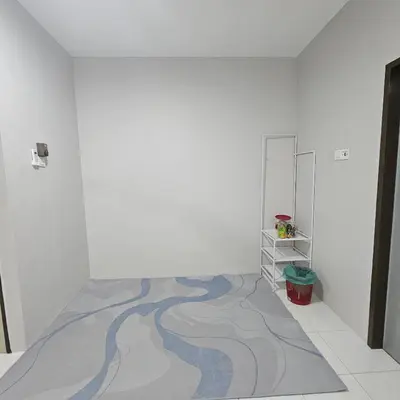 an empty room with a painting on the wall at Residensi Lourve Homestay Sungai Petani in Sungai Petani