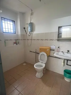 a bathroom with a toilet and a sink at Lake View From Bed Peaceful Getaway Home in Ipoh