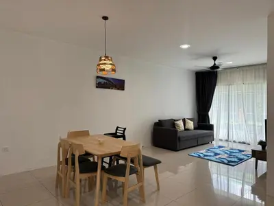 a living room with a table and a couch at Big Big Big family escape 4BR side pool view, Ipoh in Ipoh