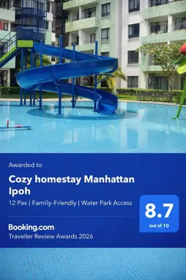 a blue water slide in a swimming pool at Big Big Big family escape 4BR side pool view, Ipoh in Ipoh