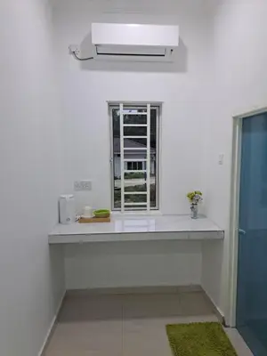 a white kitchen with a sink and a window at Teratak Sumayyah 2 - For Islam only - Pondok Lenggong in Kampong Banggol Belimbing
