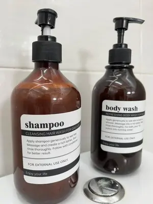 a bottle of shampoo and a bottle of body wash at Silibin Family 4B3B Homestay 11pax by Iconique in Ipoh