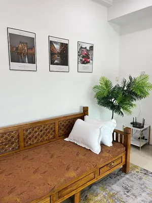 a bench with two pillows on it in a room at Silibin Family 4B3B Homestay 11pax by Iconique in Ipoh