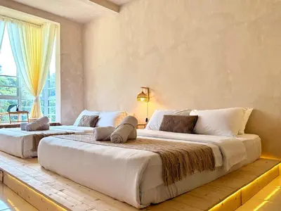 two large beds in a room with a window at Asa and Mori Japandi, Emerald Avenue, Brinchang in Tanah Rata