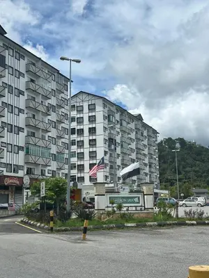 a large apartment building in front of a parking lot at The White Mist Cameron in Tanah Rata