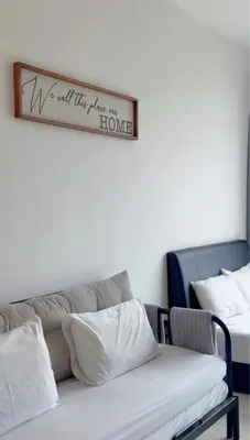a couch with a sign that reads ive got this place for home at Beacon 2BR with Infinity Pool at Jalan Sungai Pinang George Town Penang in George Town