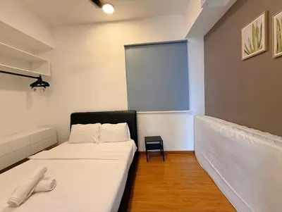 a small room with a bed and a window at Beacon 2BR with Infinity Pool at Jalan Sungai Pinang George Town Penang in George Town