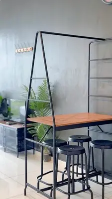a wooden table and stools in a room at Beacon 2BR with Infinity Pool at Jalan Sungai Pinang George Town Penang in George Town
